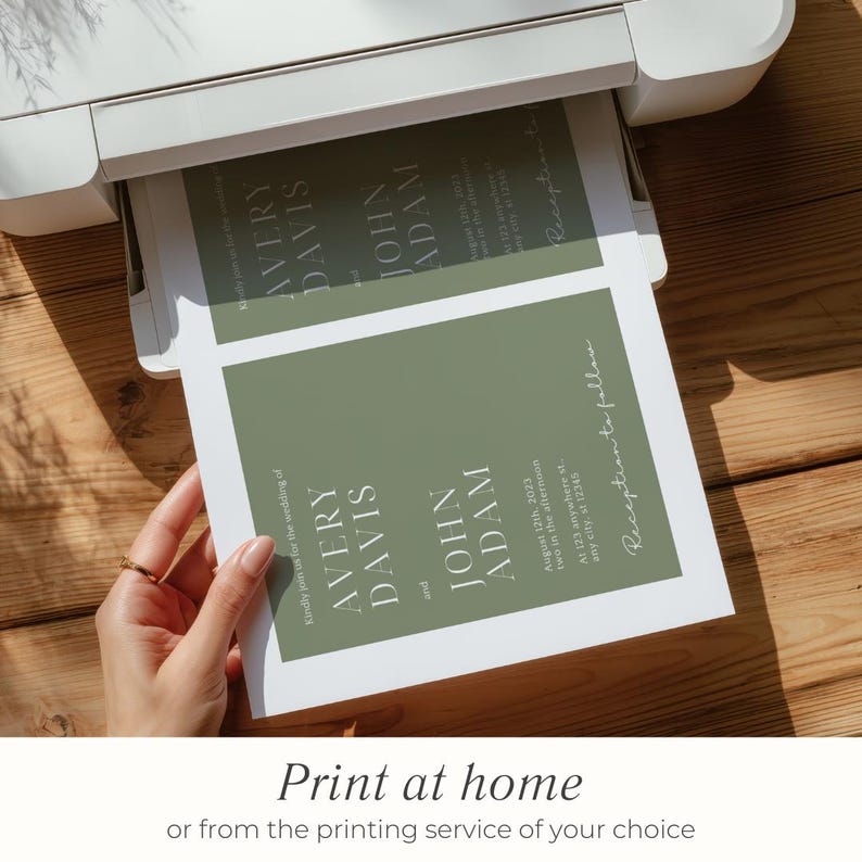 May include: A printer is shown printing wedding invitations. The invitations feature a sage green background with the names "Avery Davis" and "John Adam" in white text. The text "Print at home" is at the bottom.