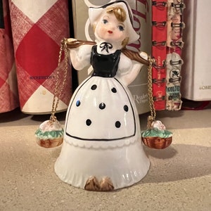 Vintage Dutch Girl Bell, cute girl trimmed in black with black polka dots, holding buckets of pink flower chimes