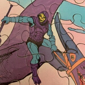 May include: A purple and blue cartoon character riding a purple and blue flying creature. The character is wearing a purple hooded cloak and has a skull face. The creature has a long beak and a yellow eye.