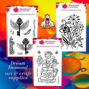 May include: Three clear stamp sets for crafting. The first set features a key with wings, the second set features a vase with flowers, and the third set features a floral design with dandelions. Each set is labeled "Woodware Craft Collection" and includes the designer's name.