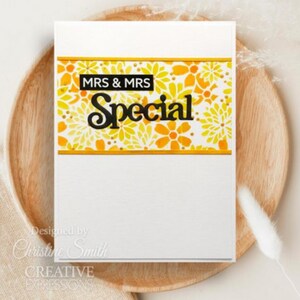 May include: A white card with a yellow floral pattern and the text "MRS & MRS Special" in black. The card is designed by Christine Smith and is from Creative Expressions.