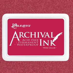 May include: A red ink pad with the text "Ranger Archival Ink" and "Acid Free, Permanent, Waterproof" and "Wine Cellar" printed on it.