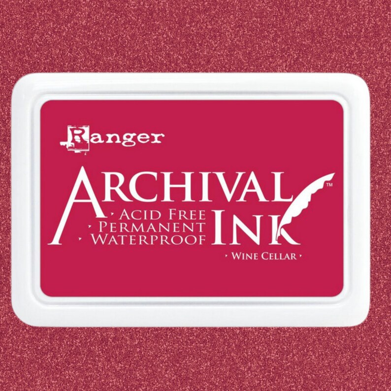May include: A red ink pad with the text "Ranger Archival Ink" and "Acid Free, Permanent, Waterproof" and "Wine Cellar" printed on it.