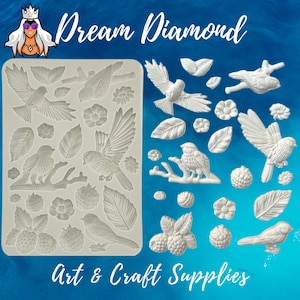 May include: Silicone mold with multiple bird, leaf, and flower designs. The mold is white and has a textured surface. The mold is on a blue background. Dream Diamond Art & Craft Supplies.