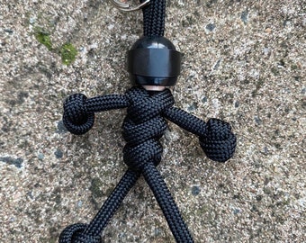 The original Biker buddy paracord buddy honda, harley davidson, yamaha, black Made with 550 paracord This will not scratch your tank