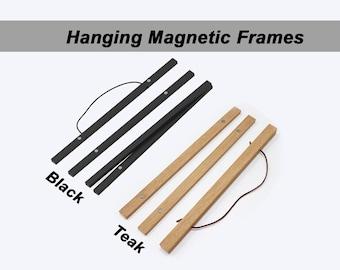 May include: Two hanging magnetic frames, one black and one teak wood. Both frames have a string attached for hanging.