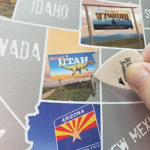 State Border signs scratch off map; State Welcome signs of United States travel poster; Road trip bucket list checkoff