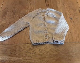 Hand knitted merino baby cardigan