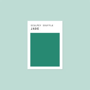 May include: Sculpey Souffle Jade polymer clay color swatch. The color is a deep green.