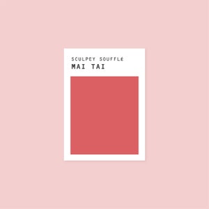 May include: A white card with the text "Sculpey Souffle Mai Tai" and a red square.