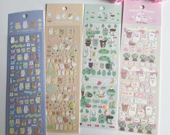 May include: Four sheets of colorful animal sticker paper with various designs. The stickers feature cute animals like bears, rabbits, and birds. The stickers are perfect for decorating journals, planners, and other craft projects.