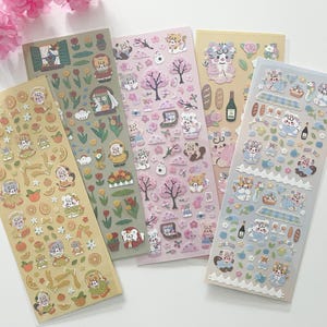May include: Five sheets of colourful stickers featuring cute cartoon animals. The stickers are perfect for decorating journals, planners, and other craft projects.