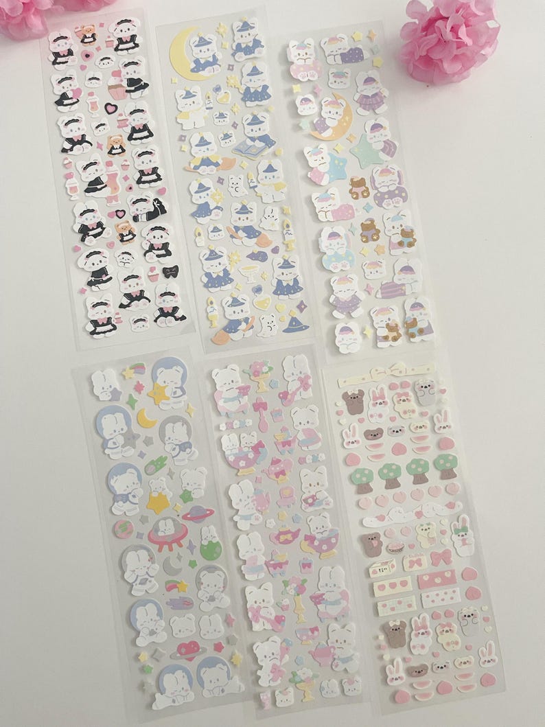 May include: Six sheets of colorful stickers featuring cute cartoon bears in various outfits and poses. The stickers are on a clear background and are perfect for decorating planners, journals, and other items.