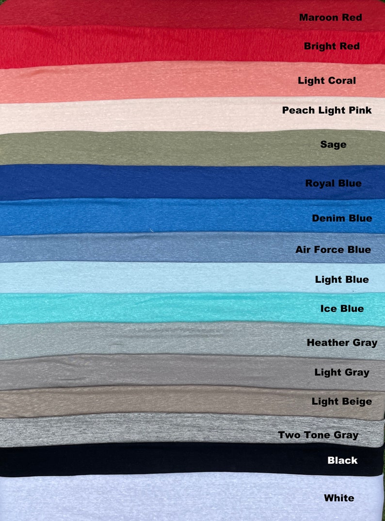 May include: A collection of fabric swatches in various colors, including maroon, red, coral, peach, sage, blue, gray, beige, black, and white. The swatches are arranged in a vertical stack, with the darkest color at the top and the lightest color at the bottom.
