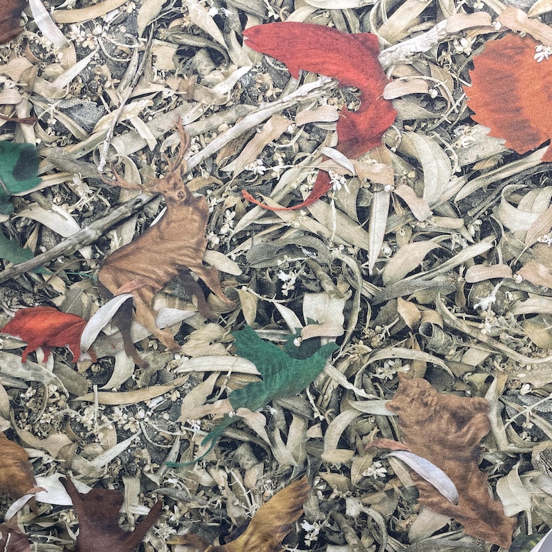 May include: A camouflage pattern featuring a brown deer, green leaves, and red and brown leaves. The pattern is on a white background.