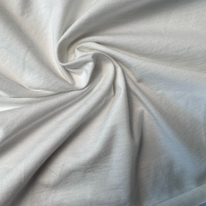 Biały bawełniany dżersej Spandex 10 oz Średnia waga Ekologiczna zrównoważona tkanina cięta na wymiar