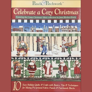 以下が含まれることがあります： 雪の降る村と冬服を着た人々、そして「Celebrate a Cozy Christmas」という文字が書かれた、お祝いの冬景色が描かれた本の表紙。本のタイトルは「Panels & Patchwork」、サブタイトルは「Easy Holiday Quilts & Crafts with Basics, Tips & Techniques for Mixing Pre-printed Fabric Panels & Patchwork Blocks」です。