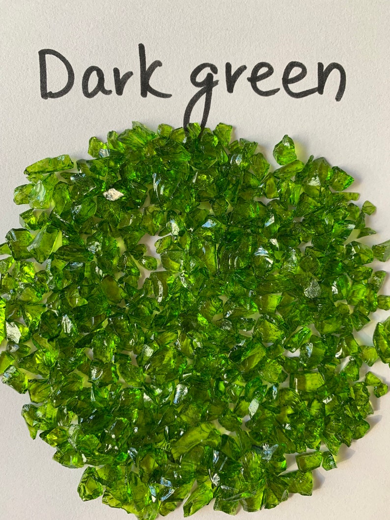 May include: Dark green glass pieces, also known as crushed glass or glass chips, are a popular material for crafts and home decor projects.