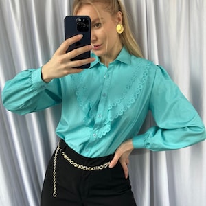 Vintage turquoise color blouse with ruffle details, elegant women&#39;s shirt