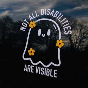 May include: A white vinyl decal featuring a cartoon ghost with a smiling face, decorated with three orange flowers. The text "NOT ALL DISABILITIES ARE VISIBLE" is printed in white capital letters in an arc above and below the ghost figure.