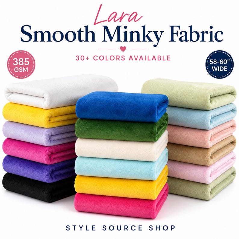 Lara Smooth Minky Fabric, 385 GSM and 58–60 inches wide. Three stacks of folded fabric in assorted solid colors including white, yellow, lavender, pink, purple, black, blue, green, cream, light blue, tan, and sage green. Text reads Style Source Shop.