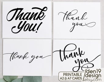 May include: Four printable thank you cards with different calligraphy styles. The cards are white with black calligraphy. The text on the cards reads "Thank You!" and "Thank you".