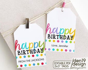 May include: Two colorful gift tags with the text "happy birthday" in rainbow colors. The tags have a polka dot pattern in red, yellow, blue, green, and purple. One tag says "From the Jacksons" and the other says "Love, Jennifer".