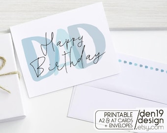 May include: A white greeting card with the words "Happy Birthday Dad" in black script and blue block letters. The card is accompanied by a white envelope and a gift box tied with twine. The card is a printable A2 and A7 card.