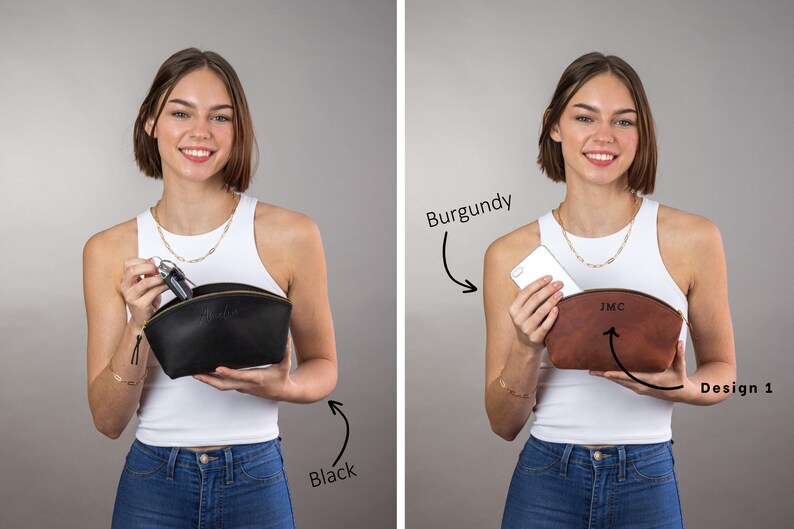 May include: Two women are holding open a black leather cosmetic bag and a burgundy leather cosmetic bag. The black bag has the word "Black" written below it. The burgundy bag has the word "Burgundy" written above it and the word "Design 1" written below it. The burgundy bag has the initials "JMC" embossed on the front.