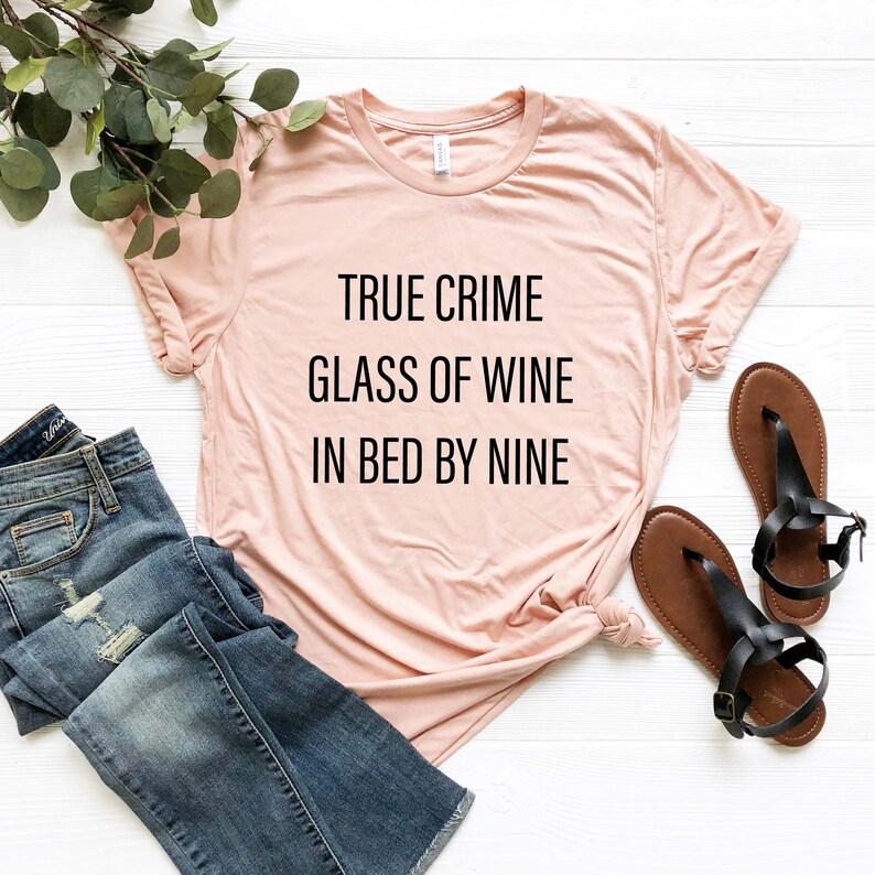 true crime glass of wine in bed by nine shirt