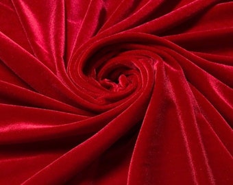 May include: Close-up of a deep red velvet fabric, showing the soft texture and rich color.