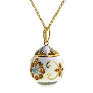 Faberge egg pendant with enamel and turquoise center stone