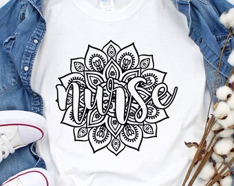 May include: White t-shirt with a black mandala design and the word "nurse" written in a decorative font.