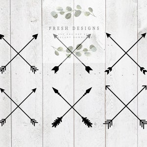 May include: Set of six black arrow designs with different arrowhead styles. The arrows are crossed in the center and point in opposite directions. The designs are on a white wood background.