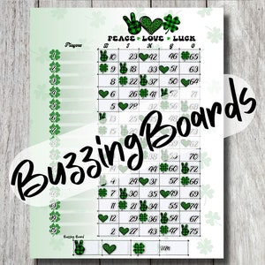 May include: A printable St. Patrick's Day bingo card with a green, white, and black plaid design. The card features a variety of symbols including shamrocks, peace signs, hearts, and bunnies. The text "Peace Love Luck" is at the top of the card.