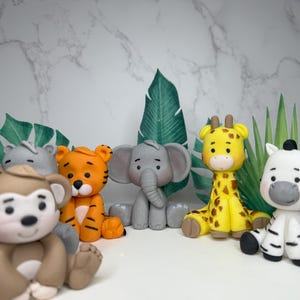 Decorazioni per torte in fondente commestibili a forma di simpatici animali da safari - decorazioni in cialda con foglie di giungla pretagliate - decorazioni per baby shower e battesimi