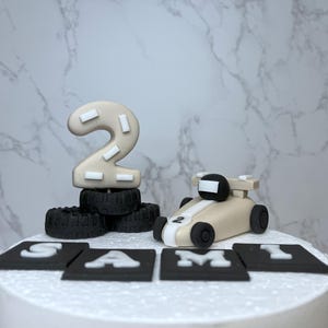 Racing car cake toppers set in neutral colours. Edible personalised birthday fondant cake decoration.  Handmade birthday boy decoration.