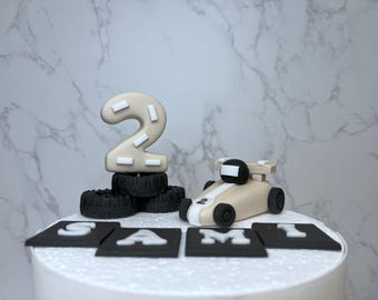 Racing car cake toppers set in neutral colours. Edible personalised birthday fondant cake decoration.  Handmade birthday boy decoration.