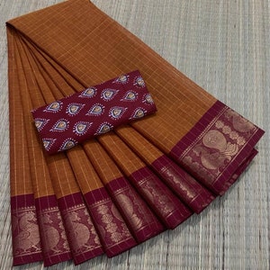 Chettinad handloom saree in classic mustard yellow and maroon combination with stitched Kalamkari blouse. Looks timeless and elegant!