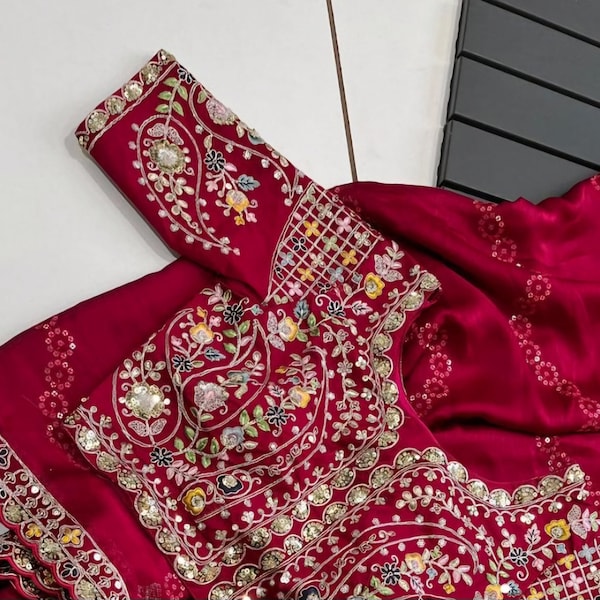 Gorgeous Rajasthani designer saree in ruby red color with embroidery work, sequins border and designer stitched blouse. Looks beautiful!