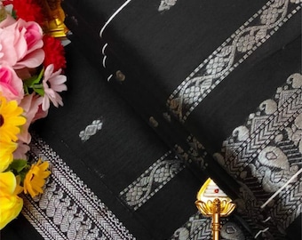 Classic black and silver combination, soft and lightweight saree with stitched blouse. Ready to wear saree. Looks beautiful when worn!