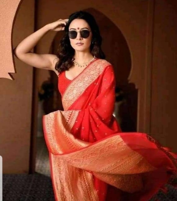 Ravishing red Banarasi sarees with stitched blouse. Beautiful Banarasi weaving work over the body. Soft, lightweight sarees Forever classic!