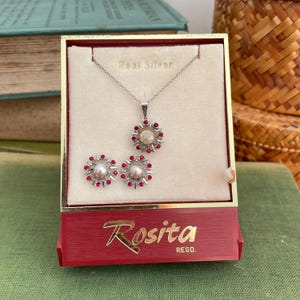 May include: A set of three ceramic mugs with a speckled, matte finish. Each mug is a different colour: light blue, cream, and grey. The mugs have a simple, modern design and a comfortable handle.