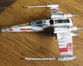 Star wars 19.5" 2002 Hasbro X wing fighter with original wings, rockets and camo.