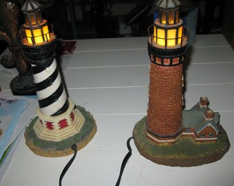 set of 2; light house table deco lamps. One is of the Portland Head light house; 04/01 E188412