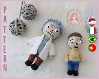 May include: Two crocheted amigurumi dolls, one with a white lab coat and brown trousers, the other with a yellow shirt and blue jeans. The dolls are standing on a white surface.