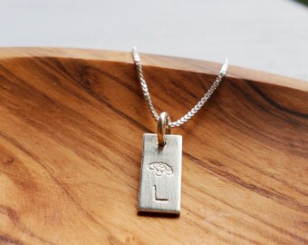 Birth flower and initial sterling silver tag necklace