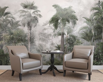 May include: Two beige armchairs with black legs and a small black round table with a glass top in front of a wall mural depicting a tropical rainforest with palm trees and fog.