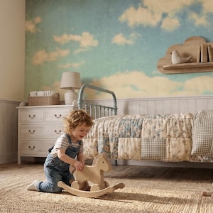 May include: A child's bedroom featuring a light blue metal bed frame, a patchwork quilt with floral and checkered patterns, a wooden rocking horse, a cloud-shaped wall shelf, a wicker basket with plush toys, and a wooden rocking chair on a rug.