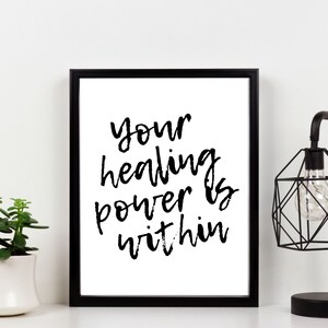May include: Black and white framed print with the text "your healing power is within" in a handwritten style.